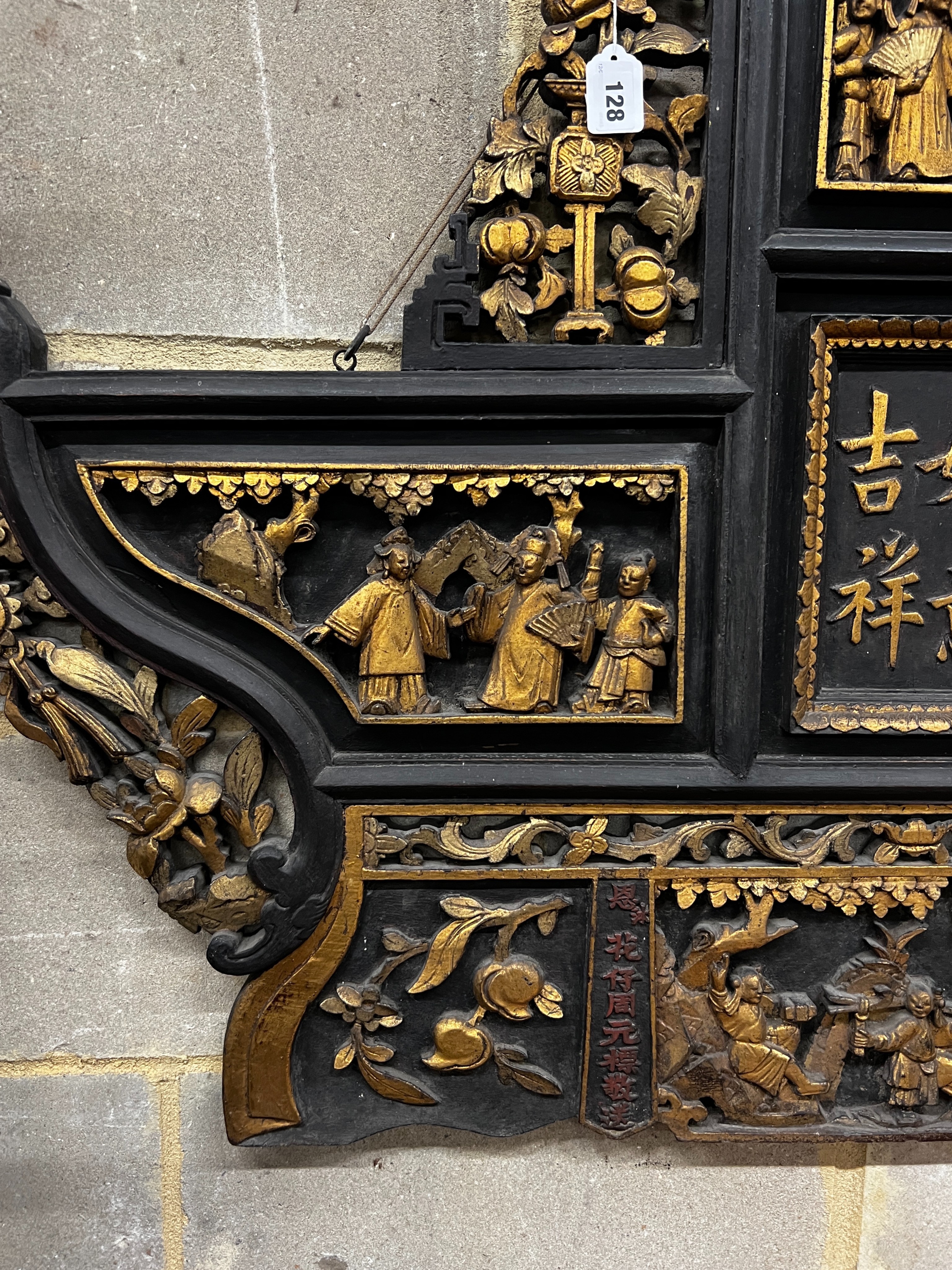 A Chinese carved parcel gilt lacquer wall plaque, width 140cm, height 107cm